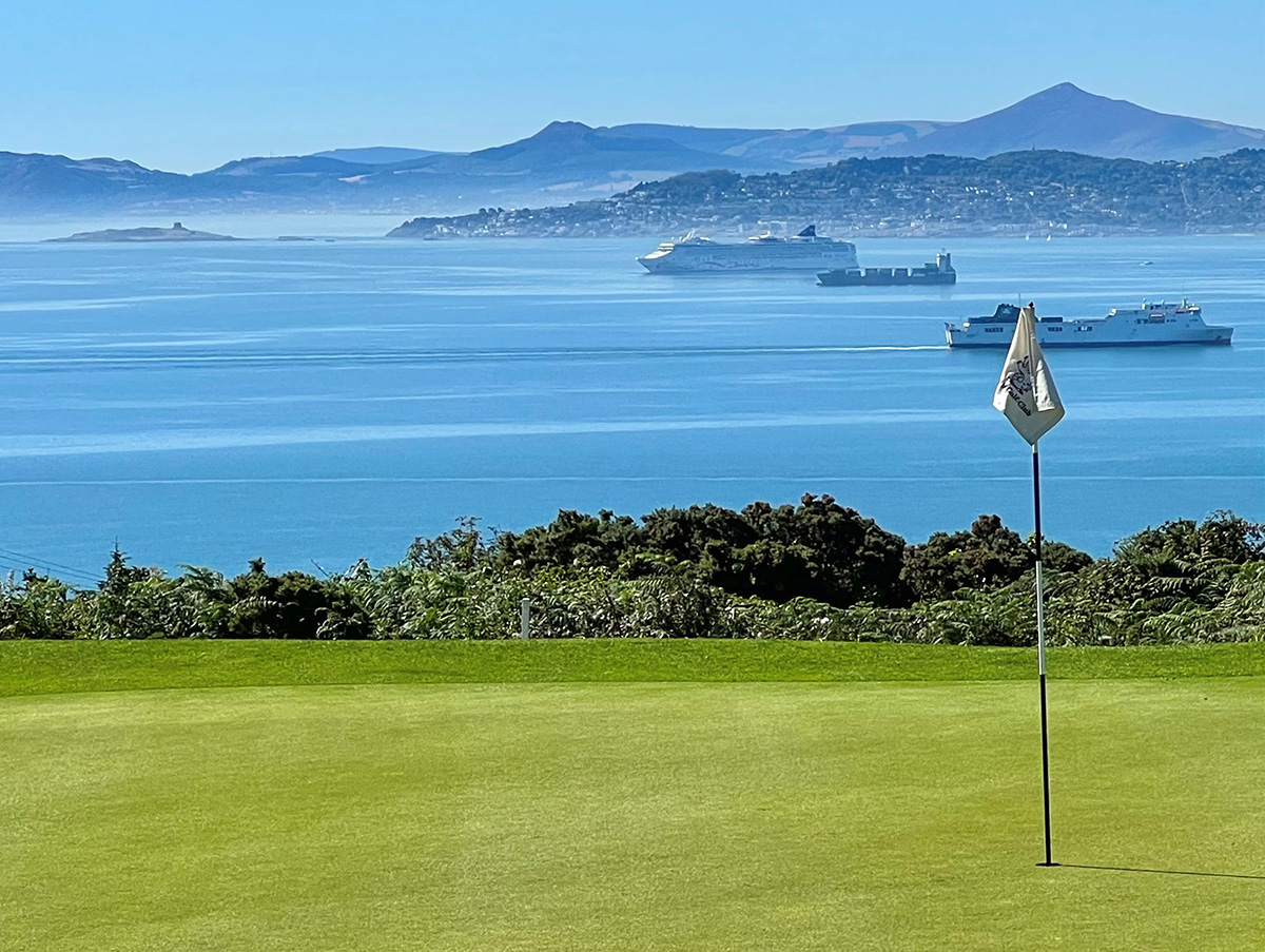Visitors playing golf at Howth Golf Club with views over Dublin Bay